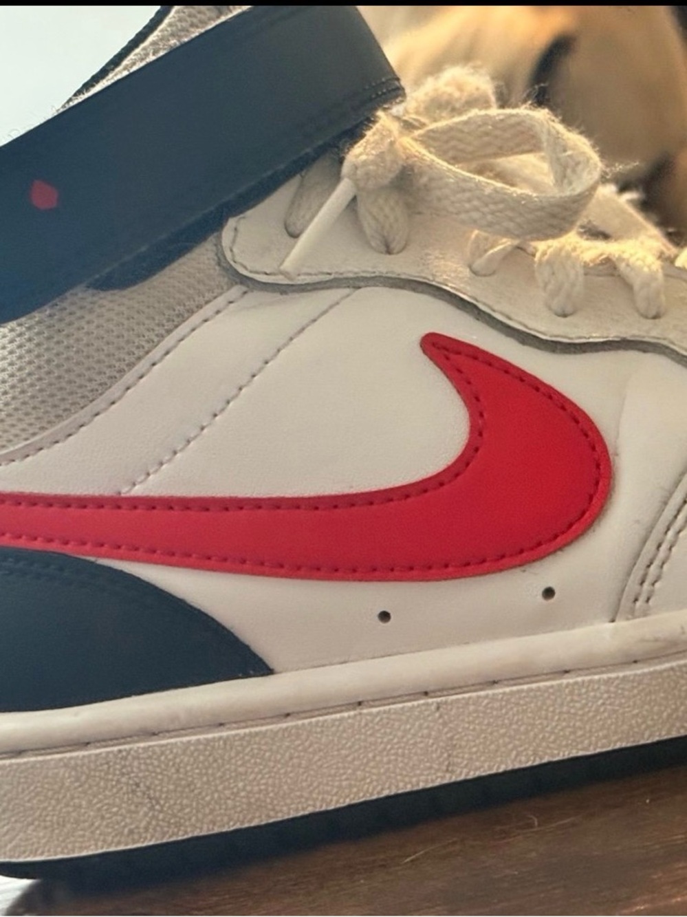 Nike Kids White Sneaker with Red Swoosh and Navy Accents